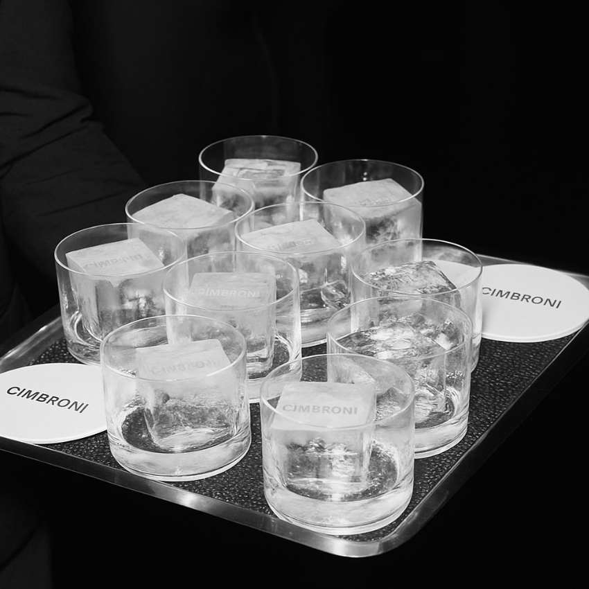Tray of Cimbroni glasses with ice cubes on a black background